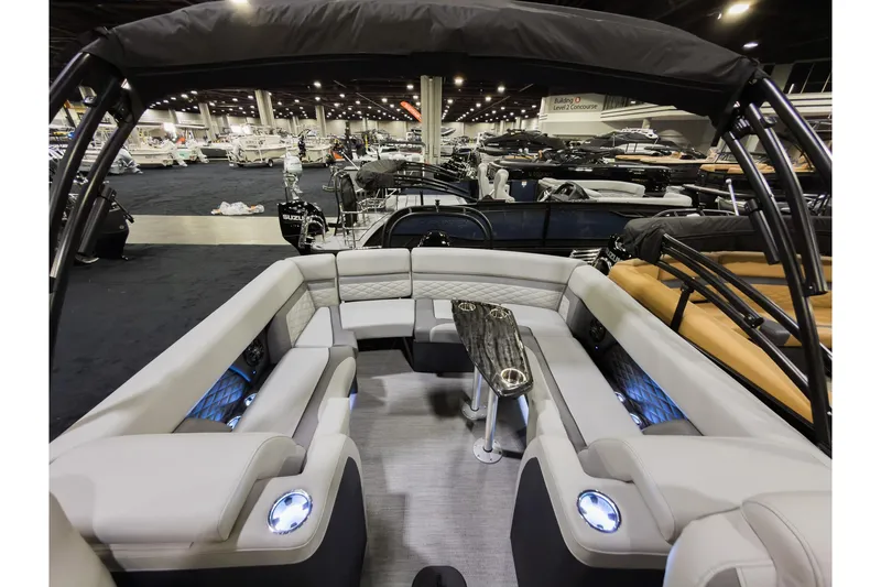 Slide: The Image of Interior of 2026 Godfrey Monaco 235 Ultra Lounge boat at a showroom display. - 21