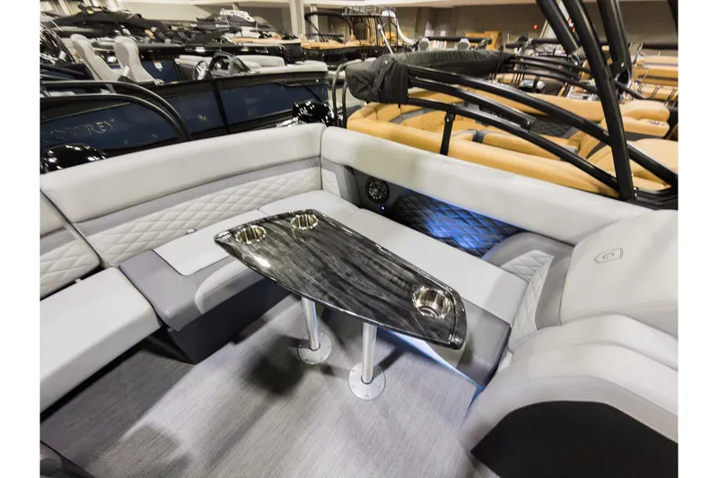 Slide: The Image of Luxurious interior of 2026 Godfrey Monaco 235 Ultra Lounge with sleek seating and modern table design. - 22