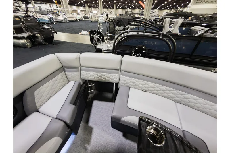 Slide: The Image of Luxurious interior of 2026 Godfrey Monaco 235 Ultra Lounge pontoon boat at a showroom. - 25