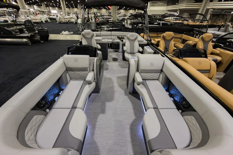 Slide: The Image of Luxurious 2026 Godfrey Monaco 235 Ultra Lounge pontoon boat interior with plush seating. - 5