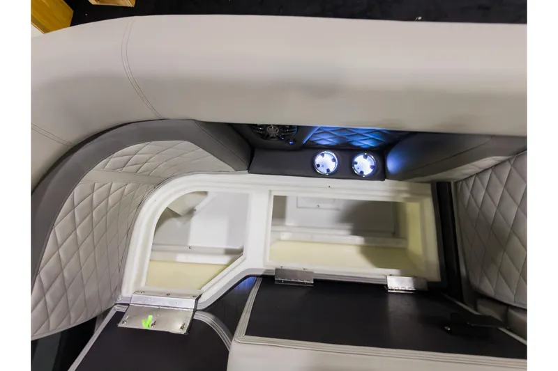 Slide: The Image of Interior of 2026 Godfrey Monaco 235 Ultra Lounge with quilted seating and illuminated cup holders. - 8