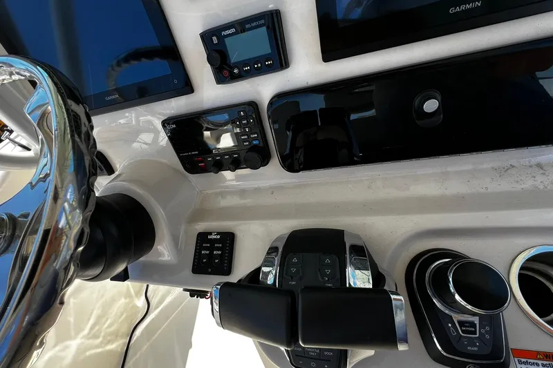 Slide: The Image of Control panel of 2022 Boston Whaler 280 Outrage with Garmin and Fusion electronics. - 14