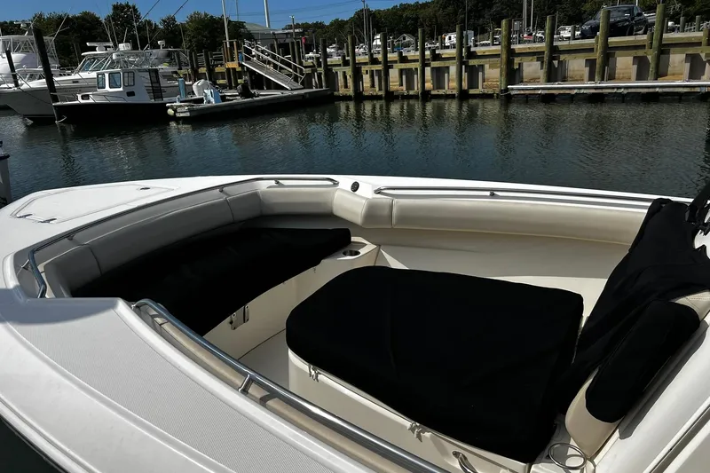Slide: The Image of 2022 Boston Whaler 280 Outrage boat interior at marina dock. - 23
