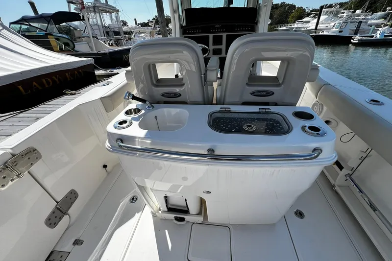 Slide: The Image of 2022 Boston Whaler 280 Outrage boat interior with seating and fishing station. - 6