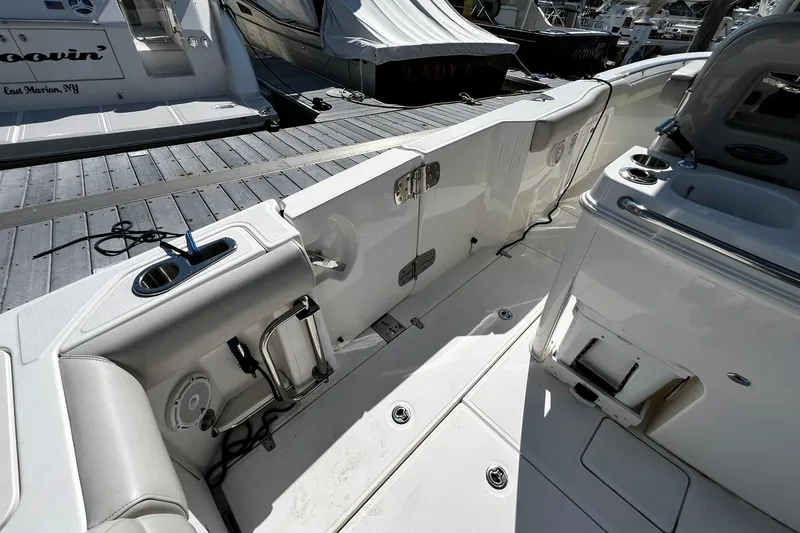 Slide: The Image of 2022 Boston Whaler 280 Outrage boat interior, featuring sleek seating and modern amenities. - 7