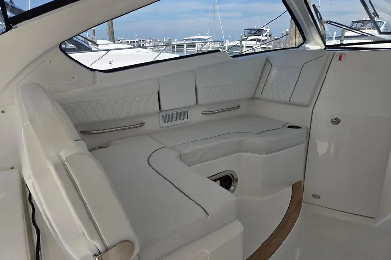 Slide: The Image of Luxurious interior of 2026 Pursuit DC 365 Dual Console boat with white seating. - 19