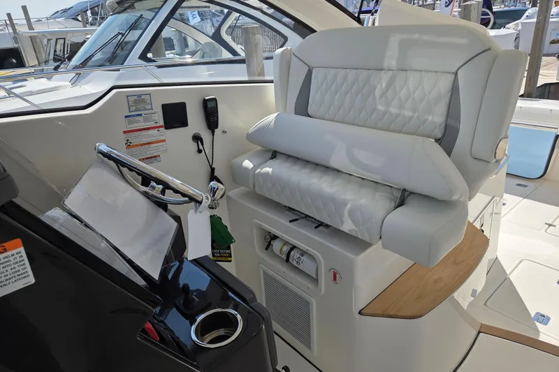 Slide: The Image of 2026 Pursuit DC 365 Dual Console boat interior with luxurious seating and modern controls. - 21