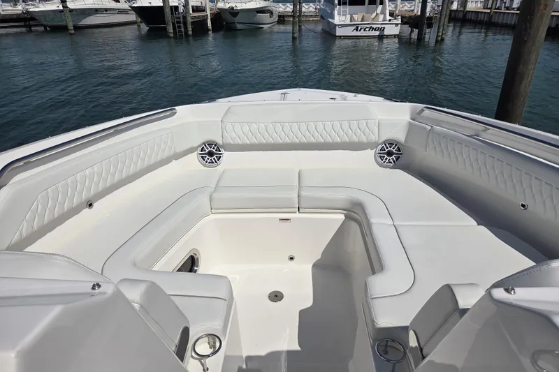 Slide: The Image of 2026 Pursuit DC 365 Dual Console boat interior with luxurious seating and waterfront view. - 3