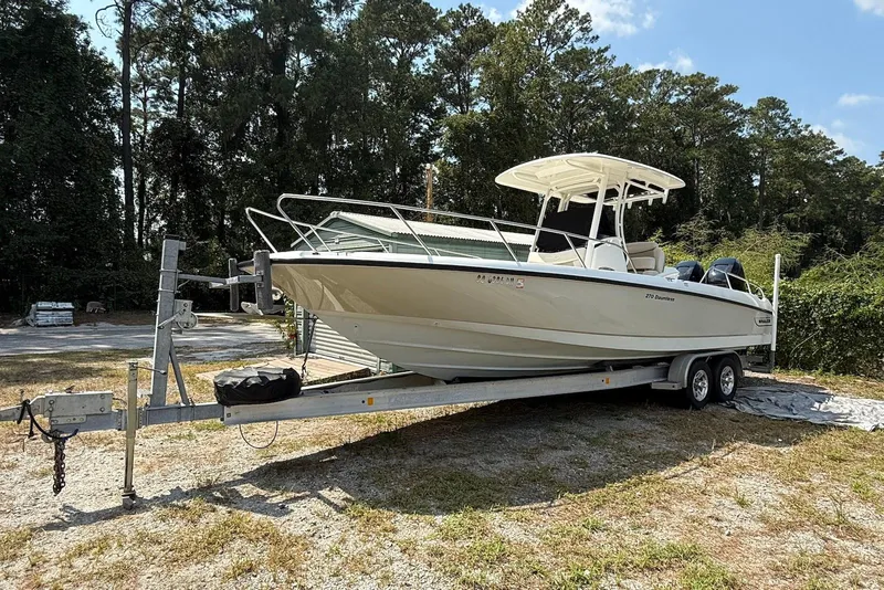 The Image of 2017 Boston Whaler 270 Dauntless boat on trailer, parked outdoors. - 0