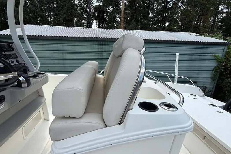 Slide: The Image of 2017 Boston Whaler 270 Dauntless boat interior with dual seats and control panel. - 12