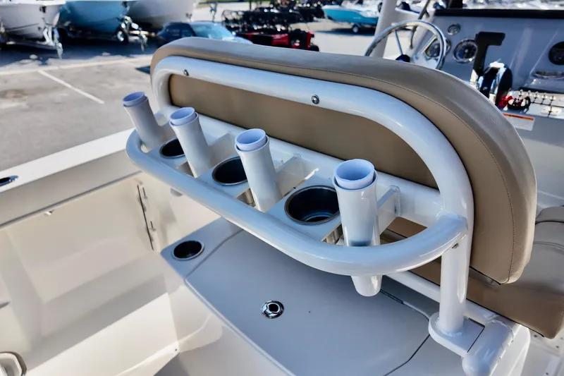 Slide: The Image of 2026 Bayliner Trophy T22CC boat interior with rod holders and seating. - 11