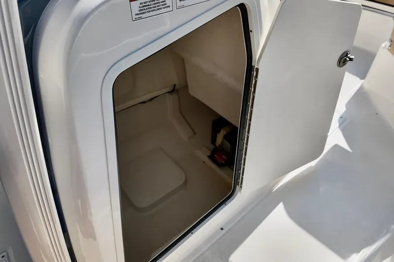 Slide: The Image of Open storage compartment on 2026 Bayliner Trophy T22CC boat. - 16