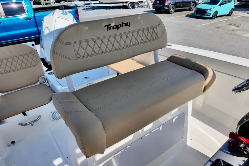 Slide: The Image of 2026 Bayliner Trophy T22CC boat interior with beige seating and modern design. - 9