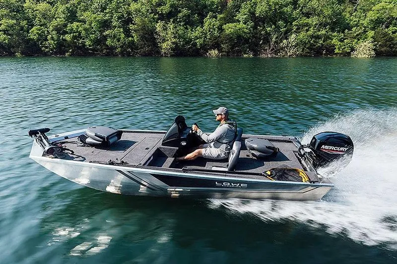 Slide: The Image of Manufacturer Provided Image: 2026 Lowe Skorpion 16 boat cruising on a lake with lush green surroundings. - 4