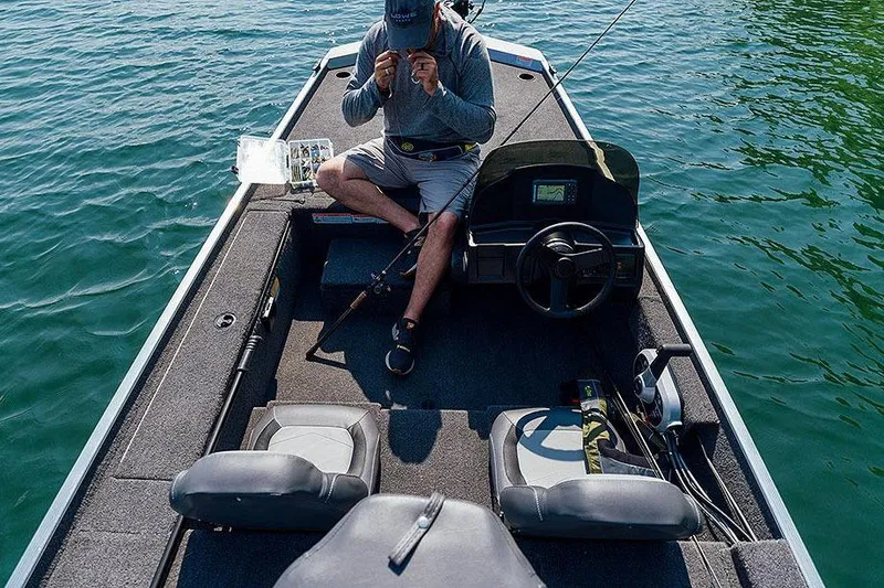 Slide: The Image of Manufacturer Provided Image: Man fishing on a 2026 Lowe Skorpion 16 boat in clear blue water. - 8