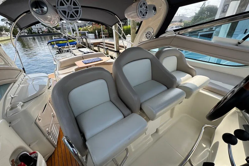 Slide: The Image of 2009 Cranchi Mediterranee 43 yacht interior with helm seats and waterfront view. - 12