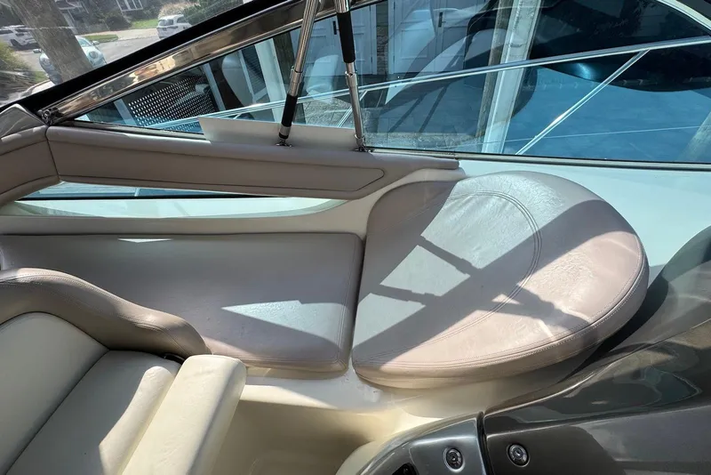 Slide: The Image of Interior seating of 2009 Cranchi Mediterranee 43 yacht, featuring beige leather upholstery. - 15