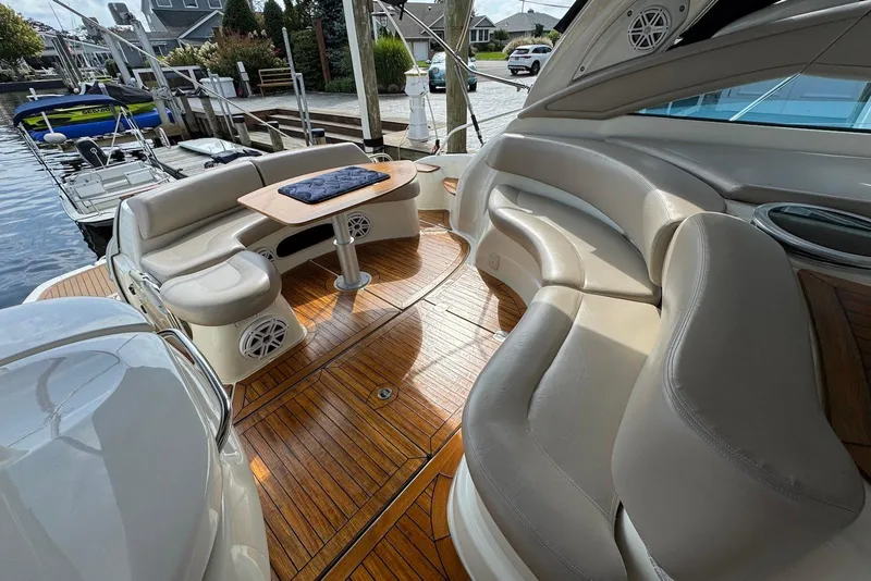 Slide: The Image of Luxurious 2009 Cranchi Mediterranee 43 yacht interior with elegant seating and wooden flooring. - 16