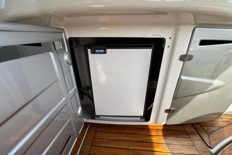 Slide: The Image of Compact fridge in 2009 Cranchi Mediterranee 43 yacht interior, with wooden flooring. - 17