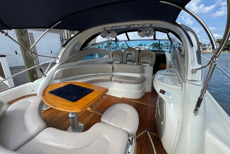Slide: The Image of Luxurious 2009 Cranchi Mediterranee 43 yacht interior with elegant seating and wooden table. - 21