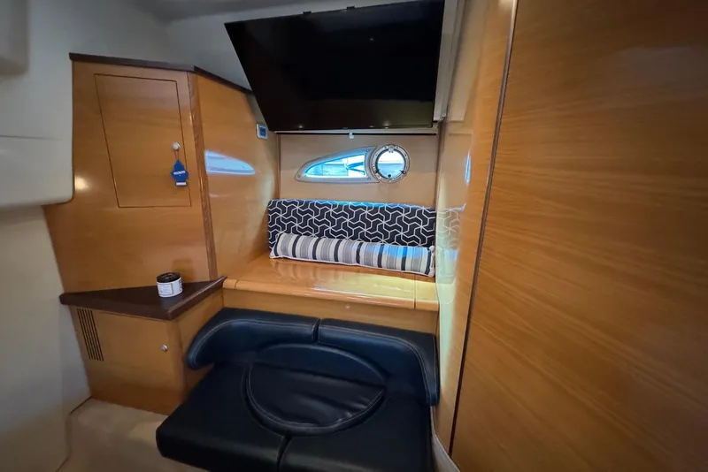Slide: The Image of Interior of 2009 Cranchi Mediterranee 43 yacht with wood paneling and seating area. - 30