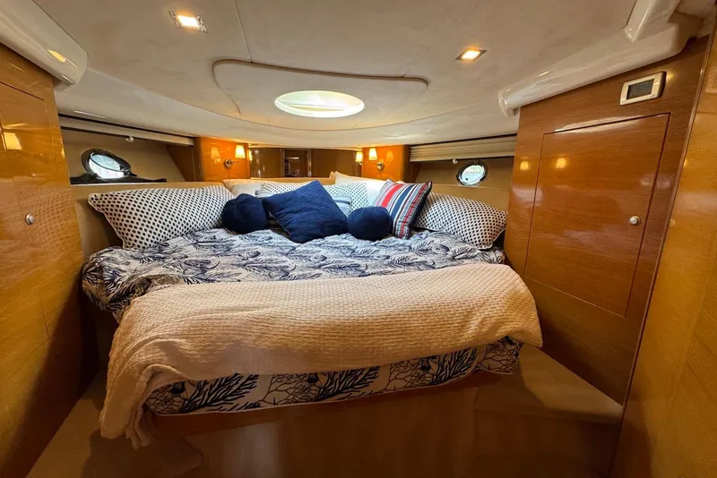 Slide: The Image of Luxurious cabin interior of 2009 Cranchi Mediterranee 43 yacht with cozy bedding. - 32