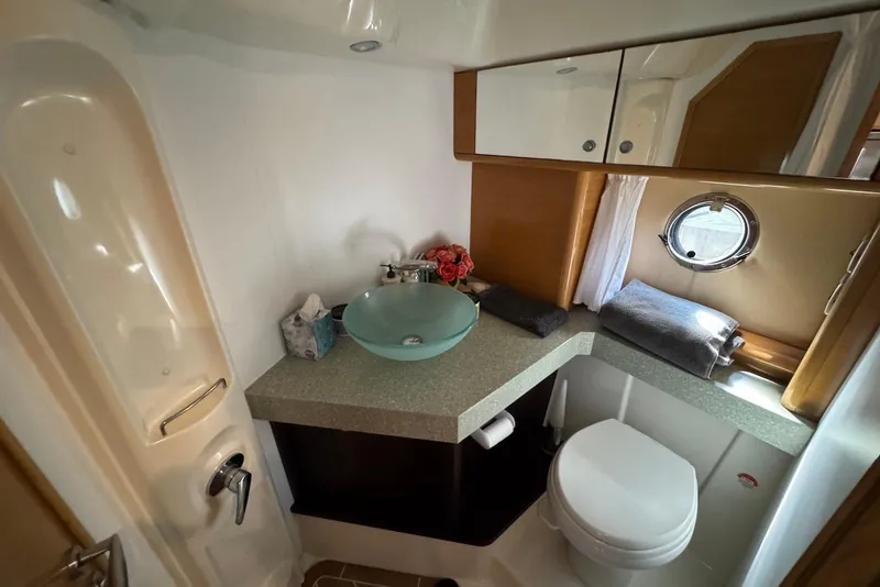 Slide: The Image of Luxurious bathroom in 2009 Cranchi Mediterranee 43 yacht with modern fixtures and porthole window. - 34