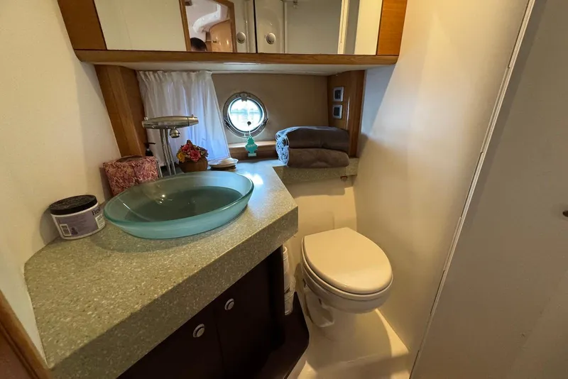 Slide: The Image of Luxurious bathroom in 2009 Cranchi Mediterranee 43 yacht with modern fixtures and porthole window. - 36
