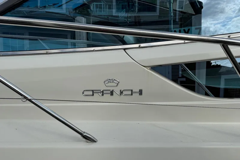 Slide: The Image of 2009 Cranchi Mediterranee 43 yacht side view with logo and railing. - 37
