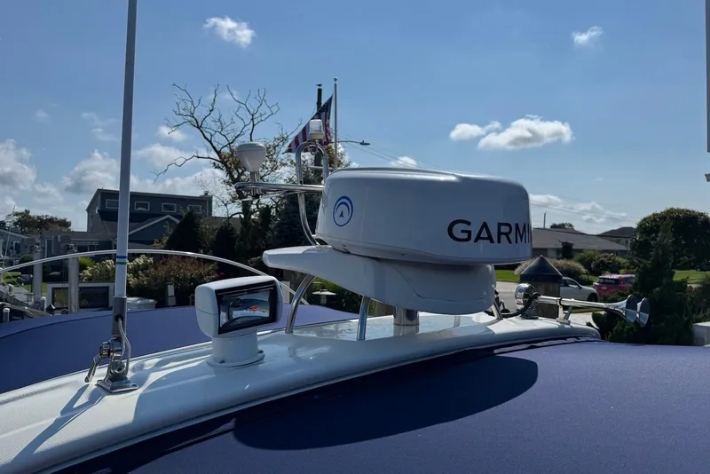 Slide: The Image of 2009 Cranchi Mediterranee 43 yacht with Garmin radar system under clear blue sky. - 5