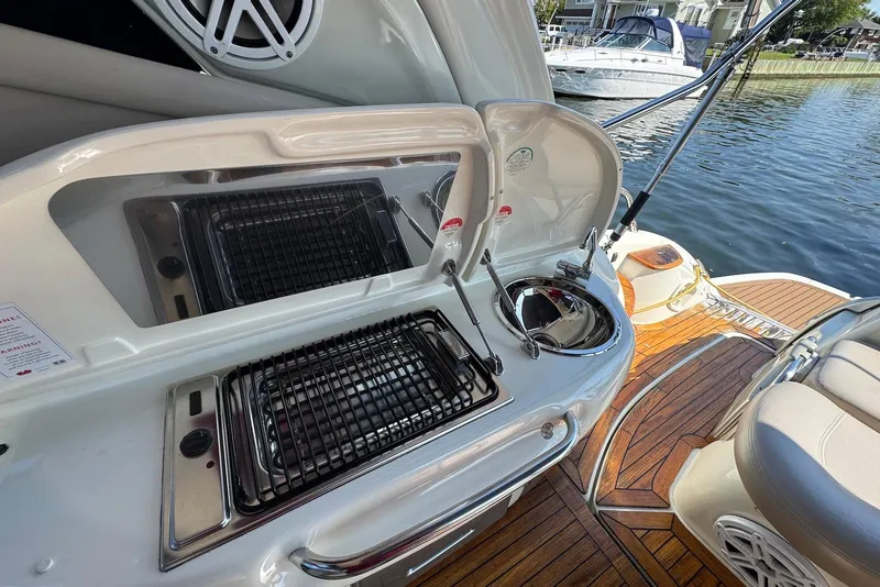 Slide: The Image of Outdoor kitchen on 2009 Cranchi Mediterranee 43 yacht with grill and sink by the water. - 7