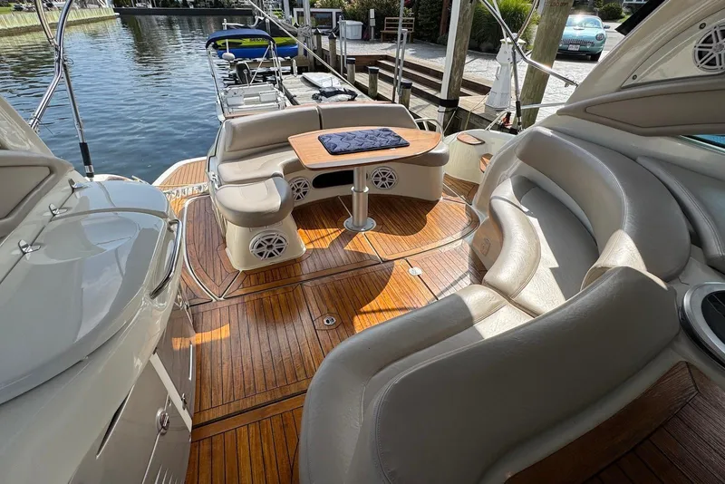 Slide: The Image of 2009 Cranchi Mediterranee 43 yacht interior with elegant seating and wooden deck. - 8