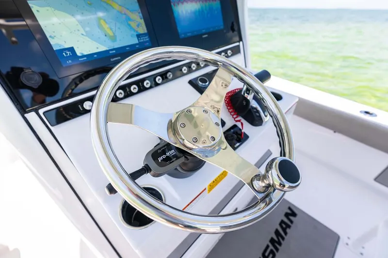 Slide: The Image of Manufacturer Provided Image: 2025 Sportsman Masters 247 Bay Boat steering console with navigation screens. - 16