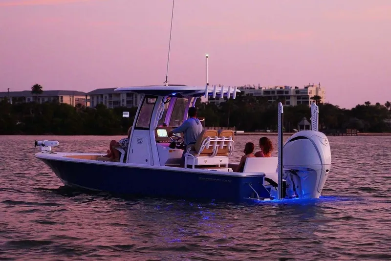 Slide: The Image of Manufacturer Provided Image: 2025 Sportsman Masters 247 Bay Boat cruising at sunset with blue underwater lights. - 5