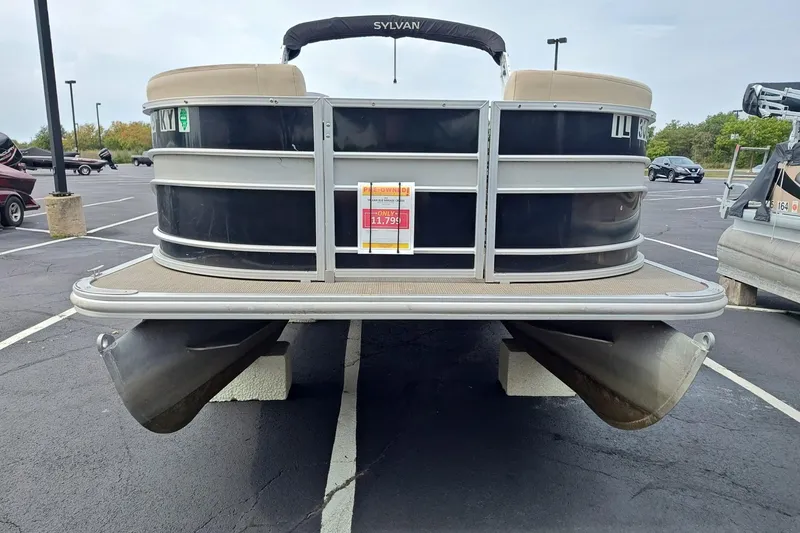 Slide: The Image of 2019 Sylvan 818 Mirage Cruise pontoon boat in parking lot, price tag visible. - 5
