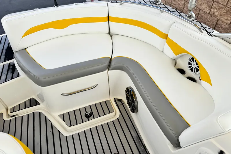 Slide: The Image of 2005 MB 240 V Sportdeck boat interior with white and yellow seating. - 22