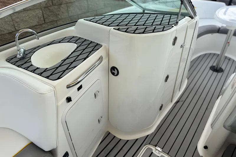 Slide: The Image of 2005 MB 240 V Sportdeck boat interior with sink and storage compartments. - 26