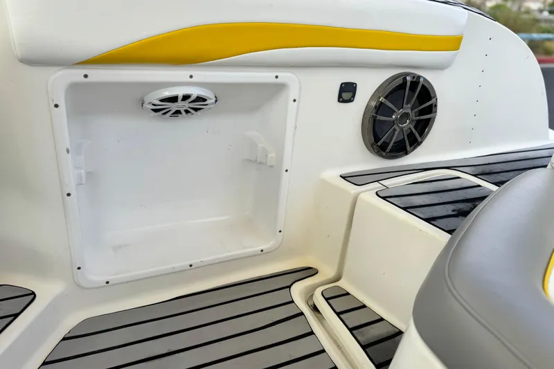 Slide: The Image of 2005 MB 240 V Sportdeck boat interior with speakers and storage compartment. - 28
