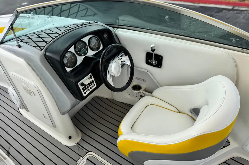 Slide: The Image of 2005 MB 240 V Sportdeck boat interior with steering wheel and dashboard controls. - 29