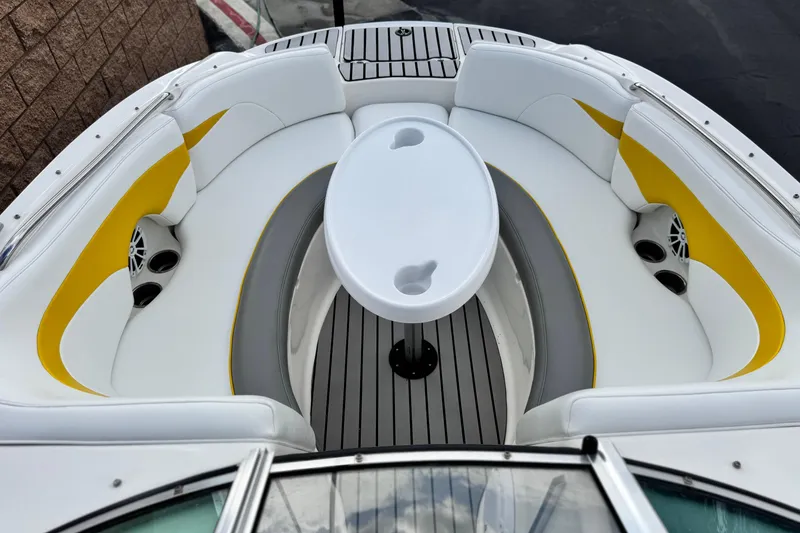 Slide: The Image of 2005 MB 240 V Sportdeck boat interior with white and yellow seating, central table. - 9