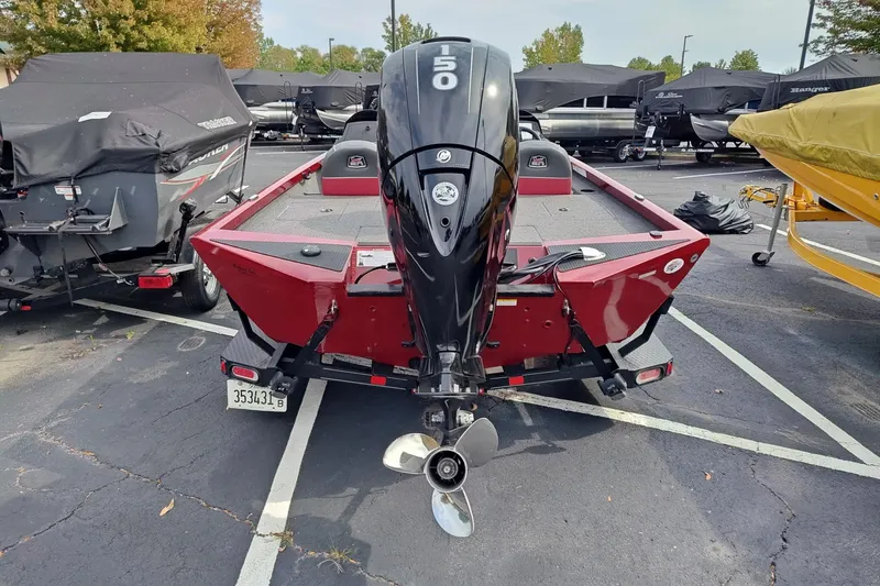 Slide: The Image of 2018 Ranger RT198P boat with 150 HP motor, parked in a lot. - 2