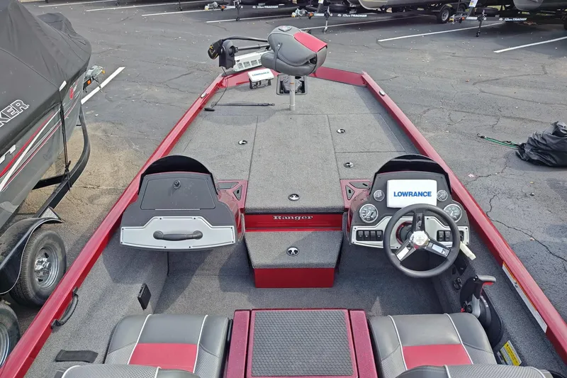 Slide: The Image of 2018 Ranger RT198P boat interior with steering wheel, Lowrance system, and seating. - 3
