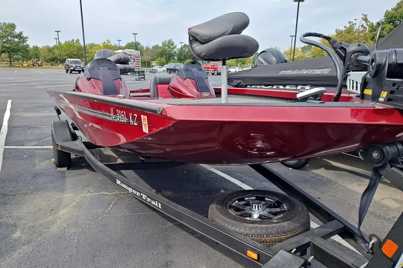 Slide: The Image of 2018 Ranger RT198P boat in parking lot, red color, on trailer. - 5