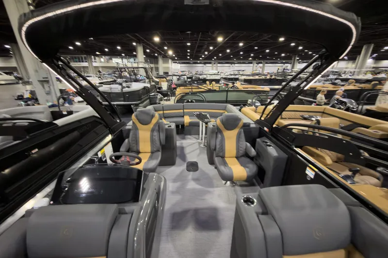 Slide: The Image of Luxurious 2026 Godfrey Monaco 255 Ultra Lounge boat interior at a showroom display. - 11