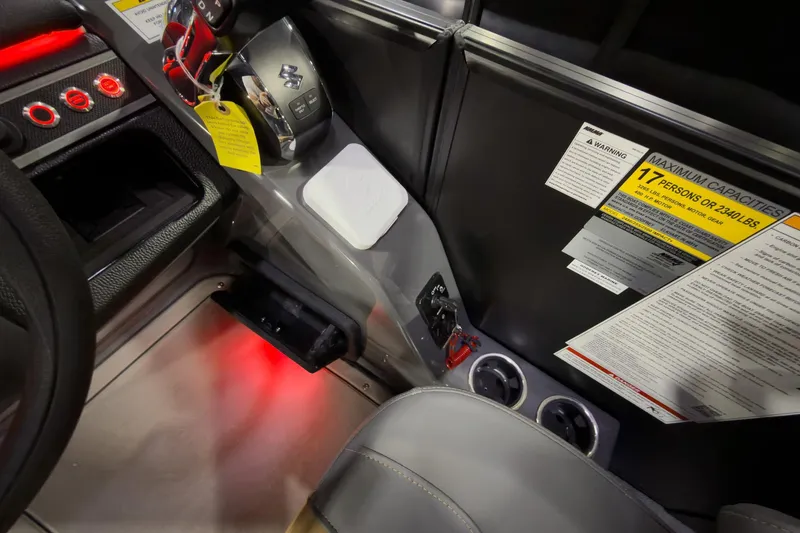 Slide: The Image of Interior of 2026 Godfrey Monaco 255 Ultra Lounge with controls and capacity warning. - 16