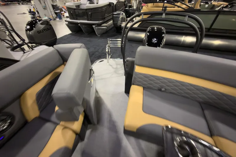 Slide: The Image of Interior of 2026 Godfrey Monaco 255 Ultra Lounge boat with gray and tan seating. - 26