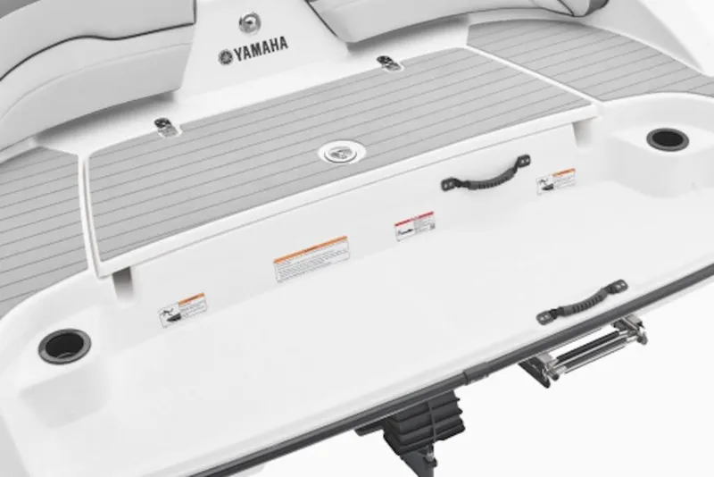 Slide: The Image of 2026 Yamaha Boats AR190 swim platform with gray decking and stainless steel ladder. - 3