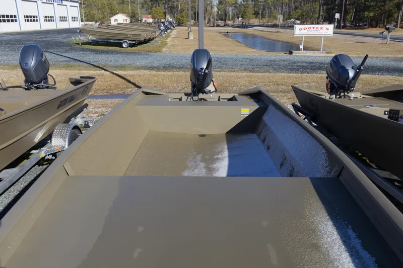 Slide: The Image of 2026 G3 Gator Tough 1860 VBW boats displayed at dealership, outdoor setting. - 7