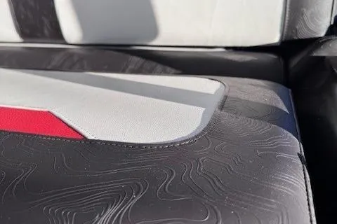 Slide: The Image of Close-up of 2025 Highfield Jet 420 seat with textured black and white upholstery. - 10