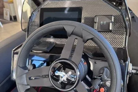 Slide: The Image of 2025 Highfield Jet 420 dashboard with steering wheel and digital display. - 11